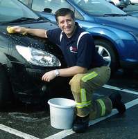Photo of Graeme at charity carwash
